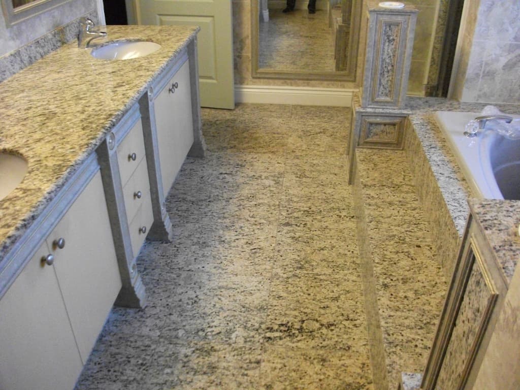 Luxury granite stone tile bathroom flooring and custom vanity countertops in Calgary, Toronto, and Vancouver